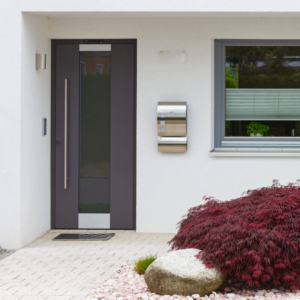 Porte d'entrée en aluminium avec éléments vitrés
